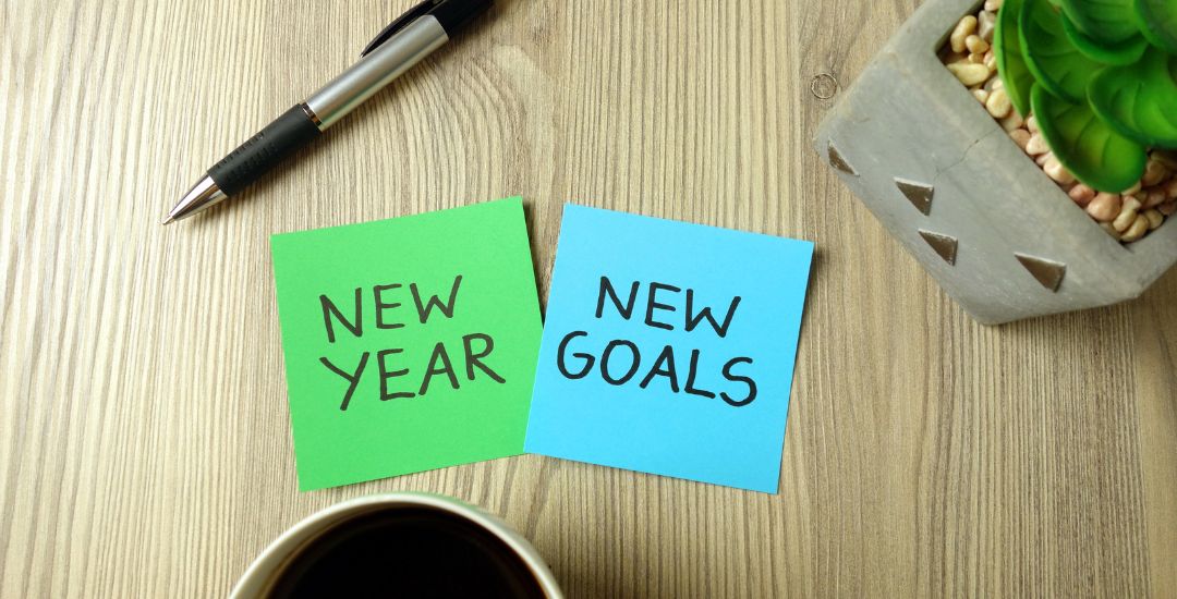 new year new goals written on post-it notes