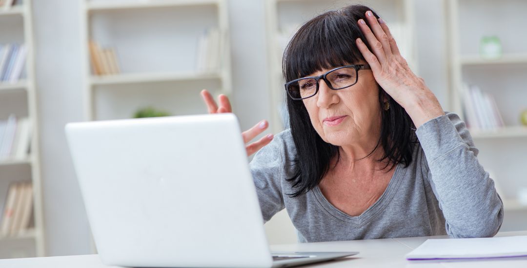 confused woman using laptop