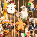 several christmas ornaments hanging in store
