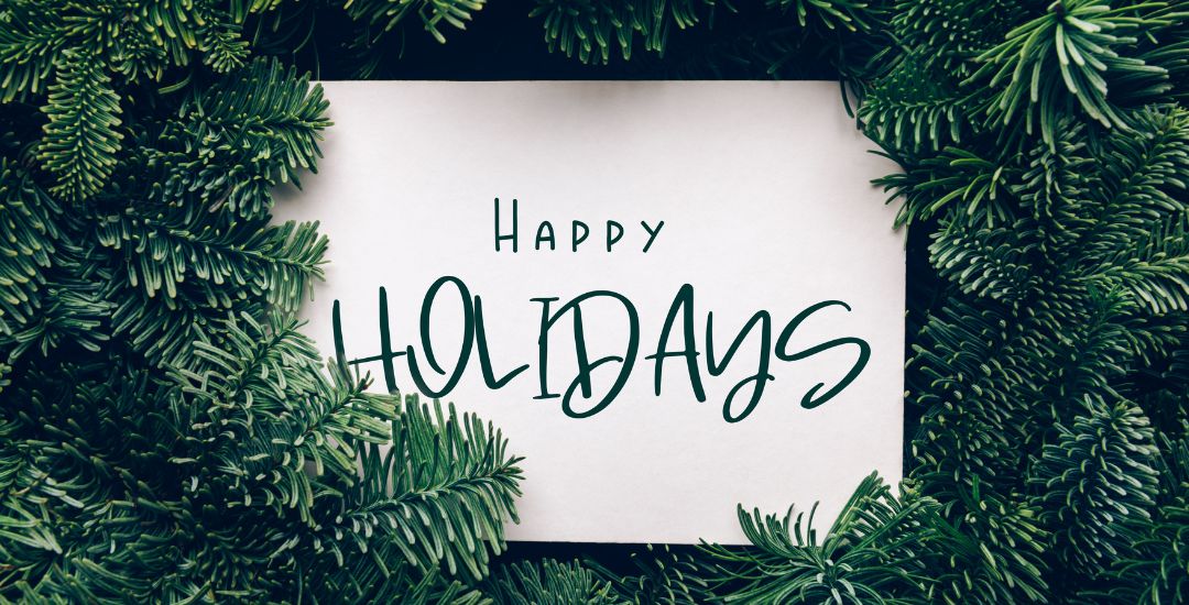 happy holidays card with evergreen background